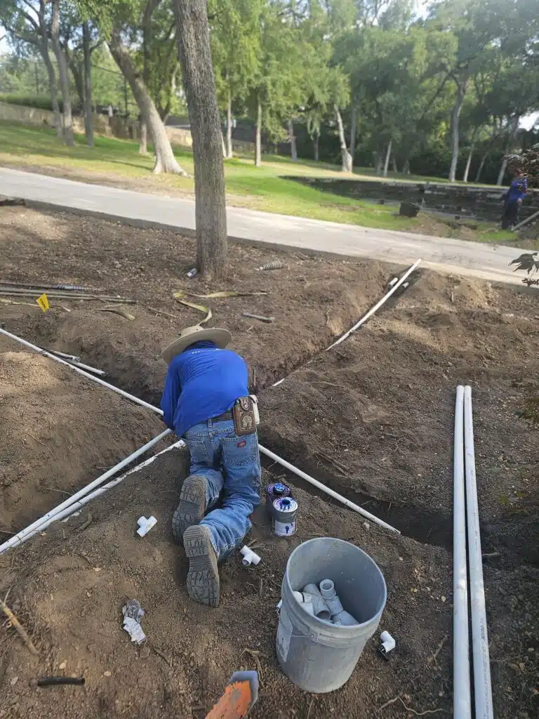 Drip irrigation system watering a sustainable garden in Plano TX
