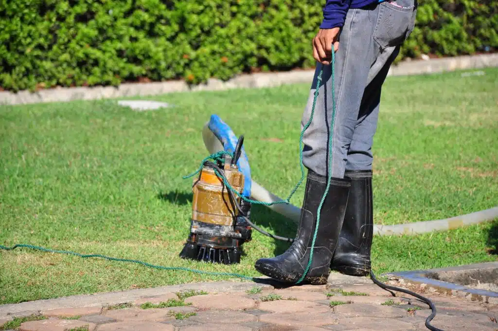 Sump pump repair service fixing water drainage issue in Plano TX home