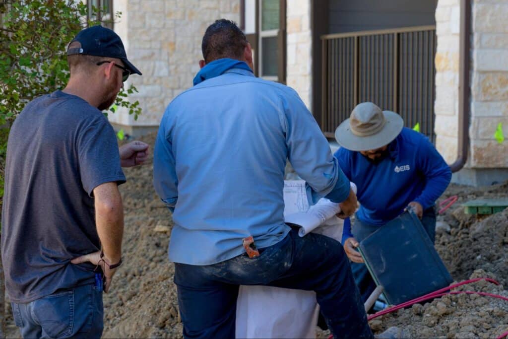 Comparison of channel drain and French drain systems in a Plano yard