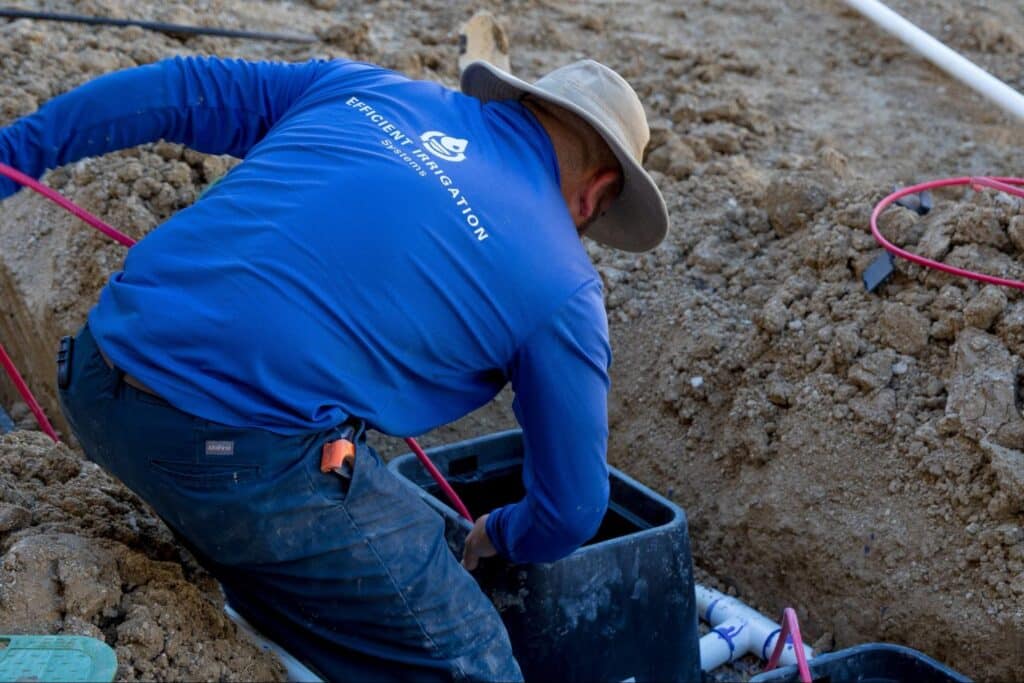 Professional French drain system being installed around Plano home foundation